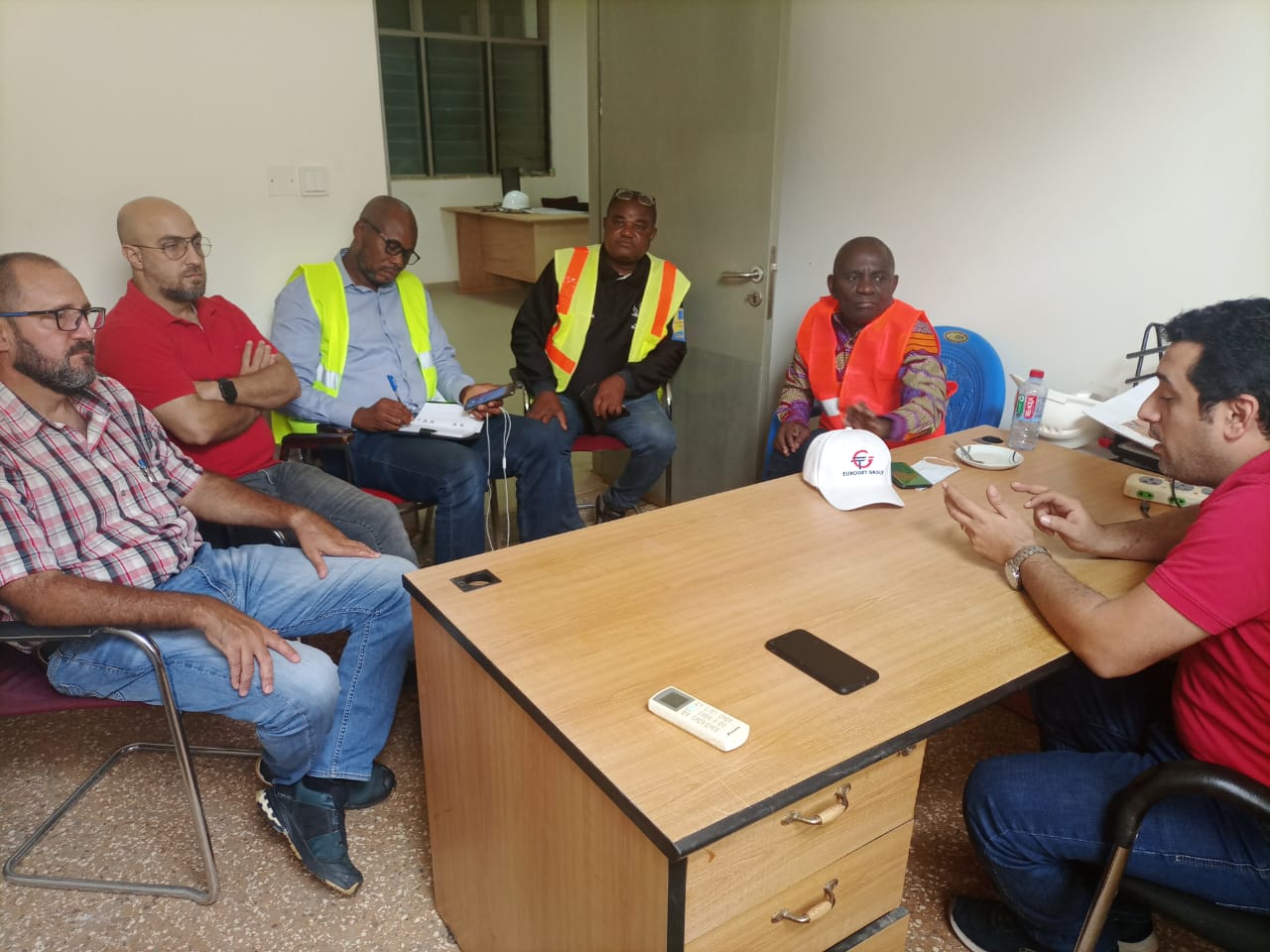 Abou Shamar (right), Afari Military Hospital Project Resident Engineer, briefing the officials, including Abraham Dwuma Odoom (2nd from right), at his office at the project site.